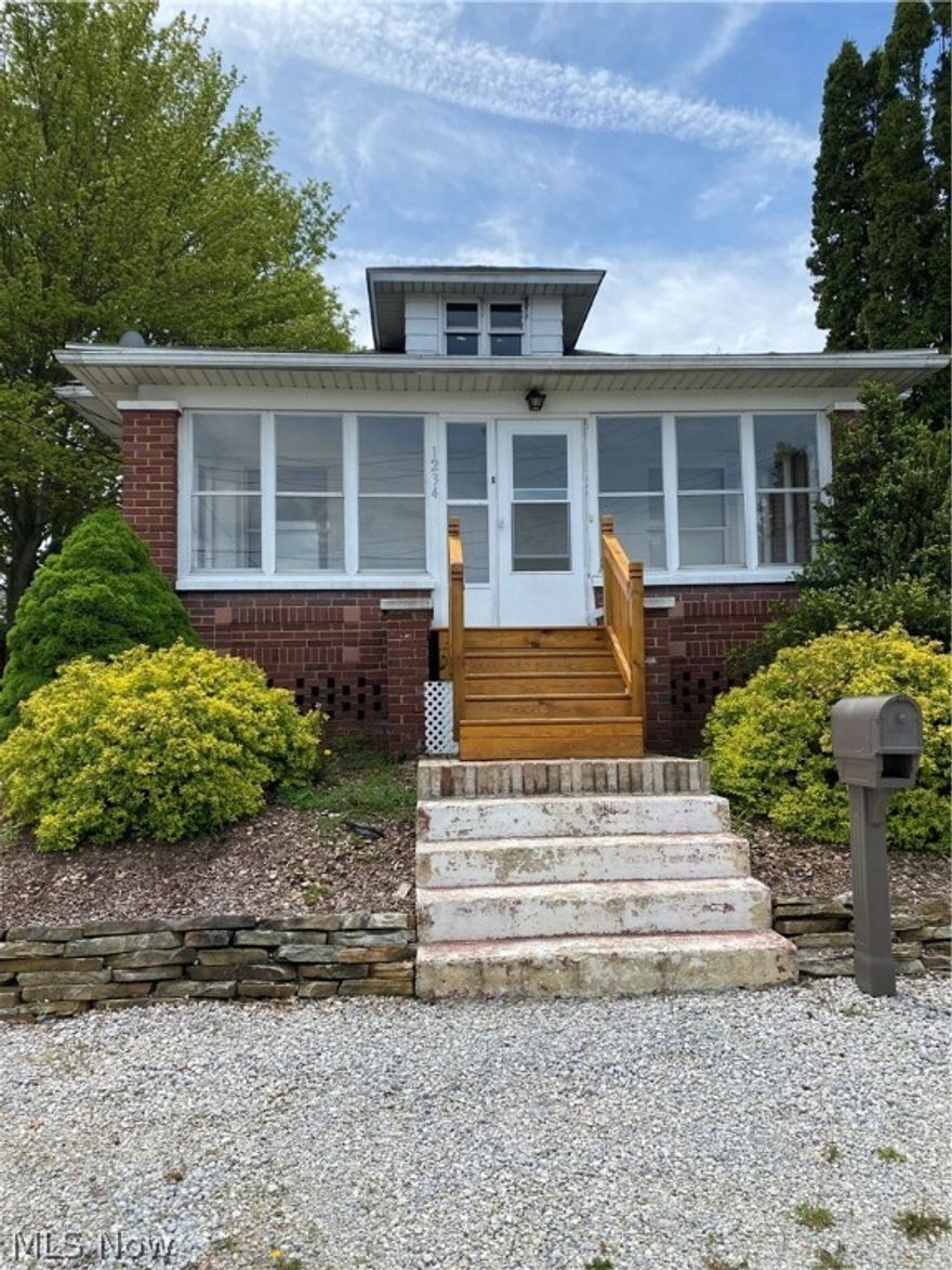 Come tour this 2 bedroom brick Ranch that features an enclosed front porch and a back deck. The 2-car detached garage is extra wide to provide for a large workshop or storage. Call today for a private showing.