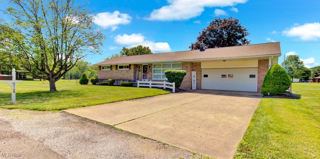Welcome home to 5168 Willow Drive -- where the charm of country living meets the convenience of town. Situated on nearly an acre of land on a corner lot, this beautifully landscaped and maintained brick ranch offers privacy and space with a fully fenced-in level backyard and a perfect covered patio, ideal for relaxing or entertaining. The spacious layout includes a bright living room that flows seamlessly into the dining area and kitchen, along with three bedrooms and two baths. You'll love the newly finished basement with mold resistant walls, perfect for family time or hosting guests, plus a new sump pump installed in 2025 with a battery backup for peace of mind. Major updates include a new roof (2021) gutter guards and downspouts (2024), new natural gas furnace (2018), new ductwork (2020), patio (2021), full backyard fence with gate (2022) and water well (2017). With a 2-car attached garage and countless upgrades throughout, this move-in-ready home is prepared to welcome its next owner.