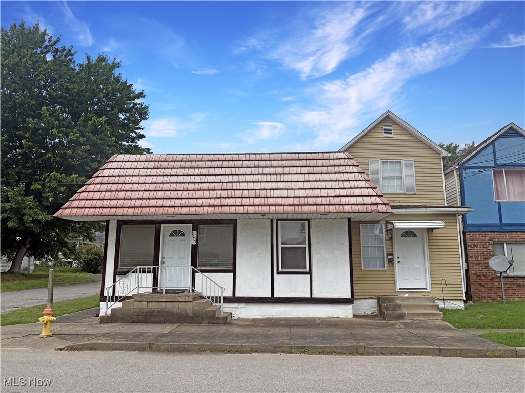 Exceptionally clean and well-maintained income-producing duplex. The two-story unit features two bedrooms, one full bath, and convenient main-floor laundry. The single-level unit offers an oversized one-bedroom layout, one bathroom, and in-unit laundry as well. Property includes ample off-street parking and is ideally located within walking distance of the city park, dining options, and other local attractions. Both units have access to the storage building, with half being partitioned off for each side