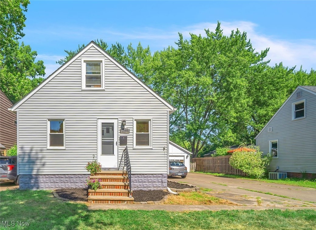Welcome to a delightful 3 Bed, 2 Full Bath bungalow in the heart of Fairview Park! This petite century home features 1st floor living with a bedroom and full bath on the main level, a finished lower level w/full bath, as well as a finished 2nd floor with 2 bonus rooms! If you value the garage space as much as the primary residence, the oversized, extra deep garage with adjoining rear workshop with separate entry will not disappoint, and includes electric, gas and water access to transform to a man-cave or she-shed like no other! Though hitting the market as one of the lowest homes in all of Fairview, this affordable property boasts a desirable list of capital improvements: roof, siding, replacement windows, newer & oversized concrete driveway as well as professionally painted main level. Oversized Kitchen w/adjoining sitting area. Petite Dining & Living Rooms. Arched entryways, coved ceilings & hardwood floors are testaments to this home’s charm & distinction. The light & bright finished basement boasts glass block windows + a freshly finished full bath with tiled shower as well as a walk in laundry room with built in shelves to keep your laundry and life in order. Full fenced rear yard. Indulgently close to every conceivable amenity and equidistant to I-480 and I-90. Fairview is a community whose Edenic backyard is the majestic Metroparks and stands on its own in offering its residents scores of amenities, eateries, diverse shopping and nearly every conceivable service provider as well as stellar city services.
