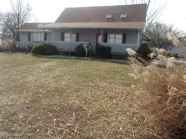 Charming home in a fantastic location featuring a spacious covered porch, perfect for relaxing. Enjoy a level yard ideal for outdoor activities. The living room and kitchen boast soaring cathedral ceilings with beautiful wood beams adding warmth and character. Roof replaced just one year ago—move-in ready with great potential!