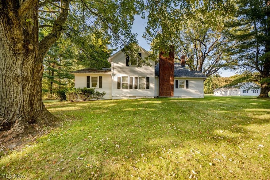 Own a slice of paradise on over 5 acres in Hinckley! This exceptional property includes a charming main house, a guest house, two storage sheds and a 3-stall horse barn with an overhead hay loft, all surrounded by old growth trees and lush foliage that provide serenity and scenery. Initially built in 1850, the main house has been lovingly maintained and updated over the years. The open concept living and dining area features a gorgeous marble tile fireplace and a charming beamed ceiling. The kitchen features plenty of cabinetry and counter space, and it leads to a lovely sunroom with sliding doors that open to the backyard. The first floor bedroom includes an en-suite bathroom. A mudroom and a half bathroom complete the first floor. Upstairs, you will find three spacious bedrooms with ample closet space and a full bathroom. The full lower level was recently repainted and includes a tidy laundry area and plenty of additional storage space. The guest house includes a large living and din