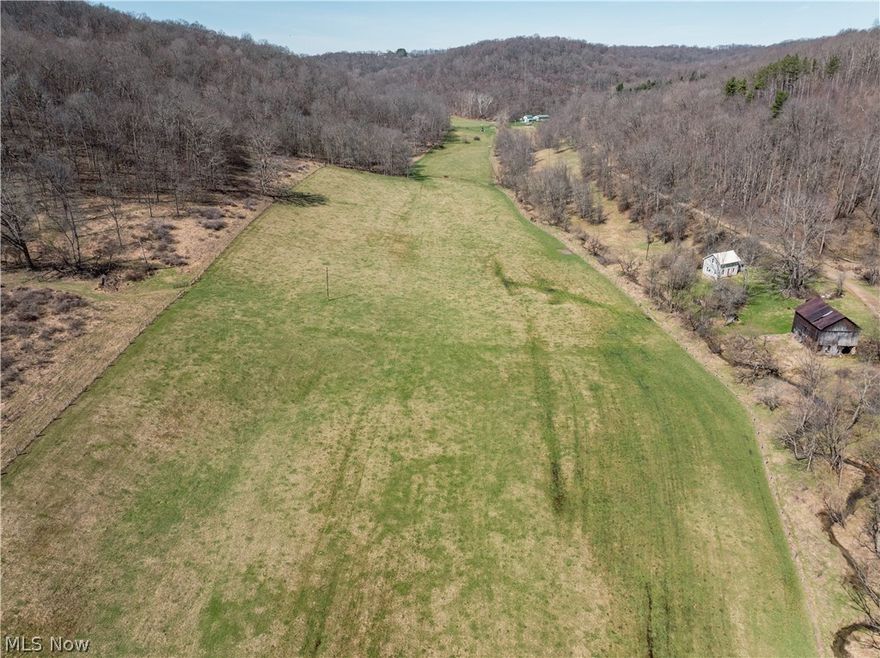 Live Auction 5/02/2026 10:00 AM - Parcel 6: 31.29 acres w/ 724’ frontage -This exceptional 188-acre offering of Holmes County land presents a rare to the market opportunity to own real estate in the well-known Stillwell area. Located just seconds from a paved road, the land features an older 3BR 2BA home, a 35' x 56' pole building, private septic, and a spring-fed water supply. The setting of the home offers peace and quiet, privacy, and ample land for gardening or animals. For the hunters, this property is situated in one of the county’s most sought-after hunting areas. Stillwell is well known for its hunting, and this property is no exception. Lots of deer trails, rubs, and scrapes, and each parcel is accessed from the east, providing favorable prevailing wind access and multiple ideal locations for food plots. A well-established trail system runs throughout the property, providing easy access. There is a nice ridgetop that spans most of the property, while the remainder of the land has a nice roll to it with a strong running creek, tons of road frontage, fenced pasture areas and ample building sites throughout. Most of the harvestable timber has already been marked and sold; these trees will be removed following the sale and are not included in the transfer. This selective harvest is expected to enhance the wildlife habitat and improve access with additional trails, bedding/cover, and browse. Whether you’re searching for a peaceful building site, prime hunting land, pasture ground, or just an investment, this property offers endless potential.