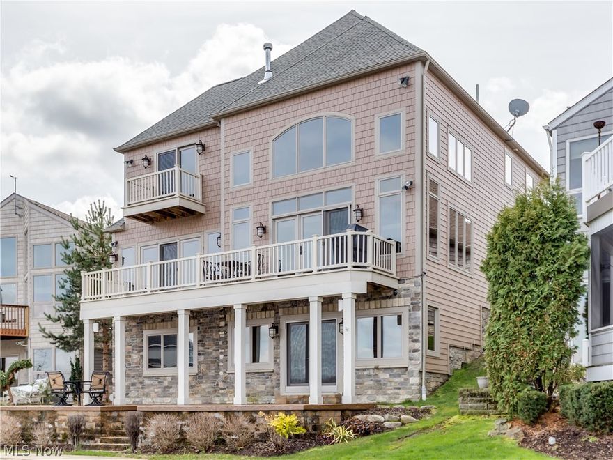Vacation yr round in this stunning & impressive Portage Lakes East Reservoir lakefront in City of Green*custom blt 2010 by KNL Bldrs w/phenomenal views, 3-4 beds, 2 full/2 1/2 baths & approx. 3242SF incl fin walkout*Unsurpassed quality & design w/2 story great rm w/coffered ceiling,wall of windows, flr to ceiling stone see thru FRPL & access to maint free deck* Gourmet kitchen w/custom cabinets w/roll out shelves, granite, SS appliances w/Jenn-air dbl oven, micro, refrig, DW, 4 burner gas burner top w/grill,walkin pantry, island w/eating area & Porcelain floor* 1st flr mstr w/wall of windows, see thru FRPL & slider to deck overlooking lake* Mster bath w/walkin tile shower, garden tub, dble vanity & walkin closet w/bltins* 1st flr laund w/ample cabinets, counter top & utility sink* 2nd lvl w/loft overlooking great rm; den/bdrm w/full wall of builtins, slider to balcony overlooking lake & walkin closet; bdrm #2 w/private access to bath, walkin closet & sitting/exercise rm; bdrm #3* Walko