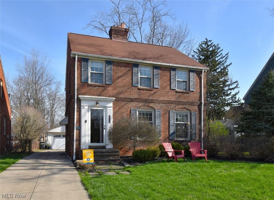 Classic brick colonial on a deep lot with tons of pride of ownership and MOVE-IN Condition. Located on an in-demand street close to shopping and steps away from Community Park which features playground equipment for children 2-a5 and 5-12, a 1/2 mile trail, pavilion and green space. Walk into this oasis of a home with georgeous hardwood floors throughout with architectural detail and traditional moldings.  Spacious living room and wood burning fireplace in the living room with great windows. Dining room opens to two-tier deck overlooking beautiful deep yard- with fire pit and plenty of room for spring/summer fires and smores! Second floor has 3 good sized bedrooms and closets, with updated bath. And on the third is a charming hide a way retreat or bedroom.  The lower level features a bar and plenty of space to kick back. This home was named one of University Heights Beautiful Homes of 2022.  You will see why when you visit. Put your feet up and relax. Welcome Home!
