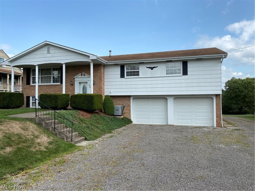If you're looking for a home with some extra garage space this is the home for you. Sitting on 3/4 of an acre of beautifully maintained lawn on the outskirts of Wintersville and this split level home has an attached two car garage. The home has three bedrooms and 2 1/2 baths. The living room features a lovely stacked stone fireplace and is open to the dining room and eat -in kitchen. Downstairs you'll find a finished family room perfect for those family get togethers, another fireplace, laundry room, storage space and the 1/2 bath. The detached two-story heated garage is large enough for workspace and plenty of room for other vehicles, toys or a rental income. This home has everything you need for your family and cars. 
    Call today to tour this unique property