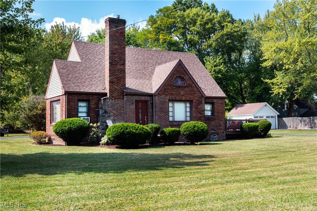 Have you been looking for a property with acreage? This adorable home is a 3-bedroom, 2 full bath, brick cape cod with almost 2.5 acres and FREE gas! Located in Austintown school district, it’s the perfect mix of the country feel but has all the amenities just a few minutes away! Outside you’ll notice a large horseshoe driveway with extra parking in front of the 2-car garage which also has a loft area for storage! The large, flat lot backs up to a farm for a gorgeous view of the sunsets every evening! Hang out on the multi-level deck, which is perfect for entertaining or just sit & enjoy your morning coffee! When you enter the front door, you are greeted with the living room that features a stone gas fireplace and hardwood floors. The dining room flows right into the kitchen which has lots of cabinetry, and appliances that stay! The eat-in area has plenty of room for a table or even could be a flex space like an office! A bedroom with hardwood floors and a newly remodeled full bathroom with stand-up shower completes the first floor. Upstairs are two additional bedrooms with hardwood floors and a full bathroom with tub, new vanity, flooring, faucet and light fixture! The basement houses the laundry area with PLENTY of storage. Updates include: Roof (2017), Septic (2017), Furnace (2018), brand new A/C just installed (2025), Sump Pump (2024), Utility Pump (2024), Dishwasher (2024) and new electrical box and service (2018). And don't forget... you won't be cold this winter while you cozy up to the fireplace and heat the house and garage with free gas! You don't want to miss out on this gorgeous property in such a prime location!