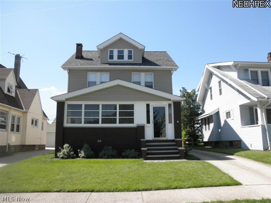 Completely update beautiful Colonial with tons of character. Pride of ownership throughout! Spacious living and dining rooms with newer carpeting and wonderful built-in cabinetry.  Renovated kitchen with Maple cabinets, newer appliances and vinyl floors.  Three bedrooms with refinished hardwood floors.  Updated main bath with pedestal dink.  Second floor porch. Ceiling fans and custom blinds throughout home.  Third floor walk-up attic great for storage and possible 4th bedroom.  Wonderful enclosed front porch with wood ceiling and floors and wall of windows. Plumbing for half bath in basement. Additional updates include, Furnace/AC & H2O tank (2007), Windows (2007), Siding (2007), Electric Panel (2007), Kitchen and Bath plumbing/electric, (2009) and Roof (2009). Two plus car garage with updated electrical and attic for storage. Walk to Garfield Park with walking trails, playground, pavilions for picnics and more. Make offer today!