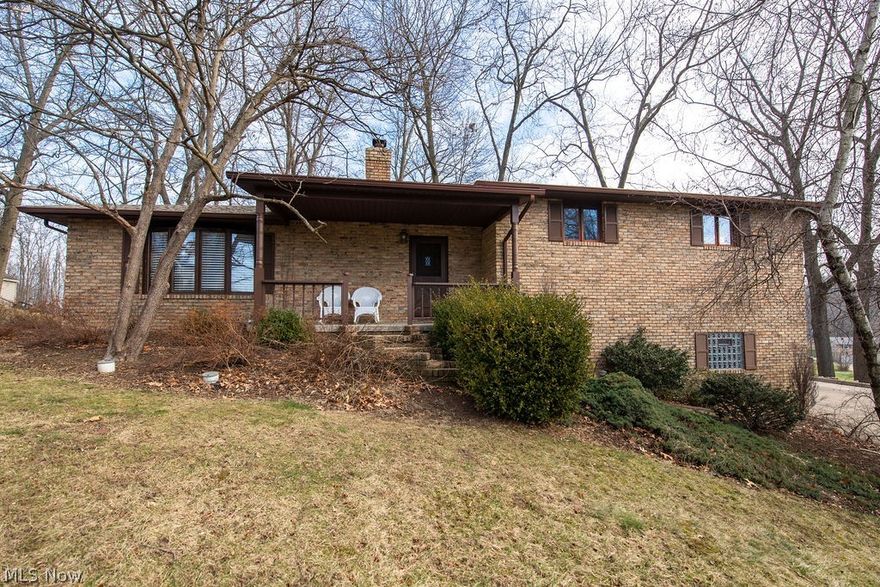 This unique custom built brick ranch in Jackson Township is situated on a cul-de-sac with stunning rear views. This 3 bedroom, with 3 full bathrooms, home has some amazing features including a three-level rear deck, a private deck of the master suite, full size front porch, solid rough sawn cherry hardwood flooring and a whole wall stone wood burning fireplace which was recently serviced. The open kitchen and large eat-in dinette area features fabulous amenities including solid cherry custom cabinets and a large center cooking island. The master bath has been completely updated.  For the entertainer, the lower level offers a spectacular family room with a wet bar. An attached 3 stall garage with 10 ft separate doors and a detached 3 story wood and stone bank barn completes this magnificent property. Enjoy the wildlife on this property while still only being minutes away from Belden Village and The Strip. New roof in 2015, newer well pump. Be sure to act fast if you are interested becau