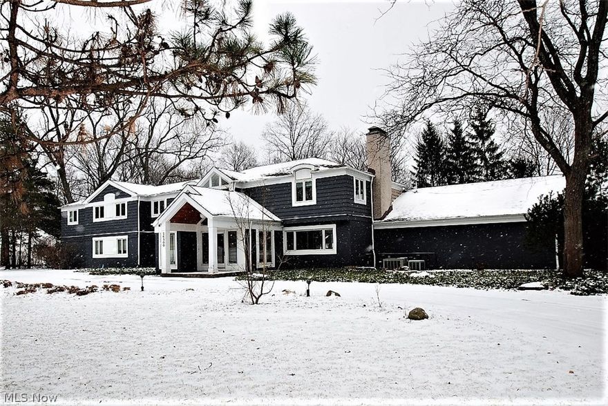 Exceptional Beachwood soft contemporary home on an approximately 1 acre lot boasts a sprawling very open layout. Enter into the dramatic two story foyer which opens to the spacious great room with walls of glass overlooking the breathtaking lot, a stunning custom glass wall surrounding the fireplace and opens to the state-of-the-art kitchen with expansive island, granite and breakfast area. First floor office and laundry. The 40 x 30 family room features slate floors, birchwood built-in's, a fireplace & a hot tub room. All the bedrooms are upstairs. Fabulous over-sized master bedroom has a tray ceiling, wonderful views and a glamour bath. The recently redone lower level is very inviting with a third fireplace. There is a 3 car garage, invisible fence, a circular drive & lovely backyard landscaping. Award winning school.s The house is located minutes from the freeway & shopping. Walking distance to the Beachwood Park with miles of jogging trails. Close to hospitals, museums & universiti