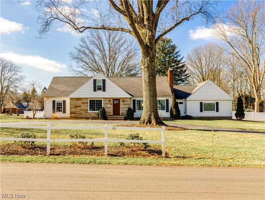 An exquisite 5-bed, 3-bath residence that seamlessly blends classic charm with modern sophistication. The 1st floor living area features hardwood floors that add warmth and elegance. A grand stone fireplace serves as a focal point, creating a cozy ambiance for gatherings with family and friends. Large windows bathe the room in natural light, accentuating the inviting atmosphere.
The adjacent chef's eat-in kitchen is a culinary haven, equipped with top-of-the-line appliances for both functionality and style. The stylish cabinetry provides ample storage, while a large walk-in pantry adds practicality. The seamless flow between the living room, kitchen, and covered patio, ensures an ideal space for entertaining and daily living. The main floor hosts generously sized bedrooms, each offering ample space for relaxation and personalization. Additionally, a home office with a separate entry from the foyer provides versatility, accommodating the needs of remote work or study.
The upper level reveals a private suite, offering an exclusive retreat with its own set of amenities and features. This section of the house provides a perfect balance of privacy and shared living spaces.
The full-sized waterproofed basement reveals another finished family room, two workshops, and laundry facilities. Outside, a screened-in porch, a meticulously maintained yard with an English garden, and additional features like newer windows, roof and a Gravity fed Hot Water system, make this home a perfect blend of comfort and luxury.  Situated on a corner lot, the circular driveway sits in front of a new porch, adds to the house's character and provides convenient access. A separate, unshared driveway ensures private entry to the two-car garage, offering both practicality and exclusivity.