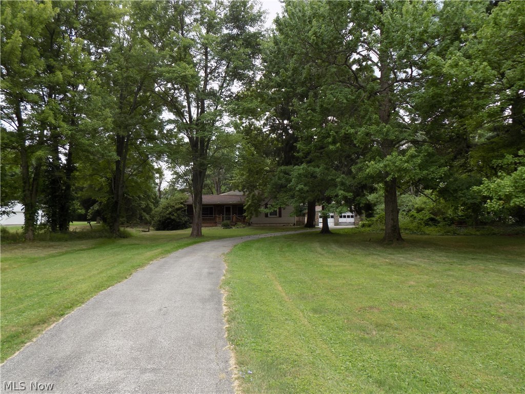 Much potential here with this 3 bedroom handy man special located on a 1.5 acre semi rural parklike lot. Bonus 24x24 newer finished and heated outbuilding. Home features an eat in kitchen, fireplace, covered front porch, some hardwood floors and a 2 car garage. Roof and vinyl windows appear to be updated. "Sold as is".