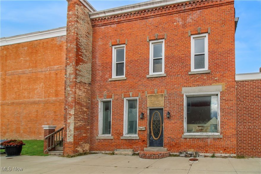 There is so much potential in the downtown Port Clinton corner lot! Green space with a 2-story brick building. The interior has been gutted so you can use your imagination to finish this space.