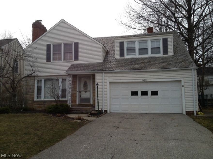 VERY special home in a VERY special location.  Unique four bedroom home with over-sized 2 car attached garage and mud room.  Eat in area overlooks wonderful backyard with gazebo and playground.  Beautiful look throughout, totally move in ready including divided basement area with loads of available storage.