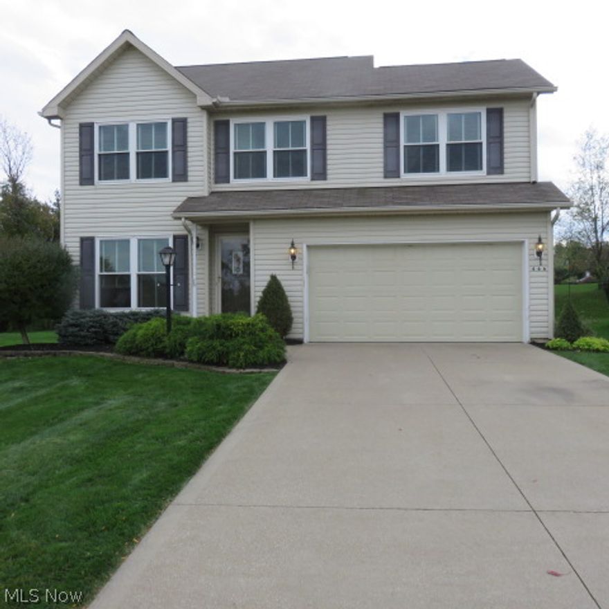 Lovely 4 bedroom colonial, 2 1/2 bath, and eat-in kitchen.  Family room has beautiful dark wood-like laminate floors with a wood burning fireplace insert that will help heat your main living level during those cold months.  Master bedroom has a vaulted ceiling and light-filled master bath.  Priced to sell.