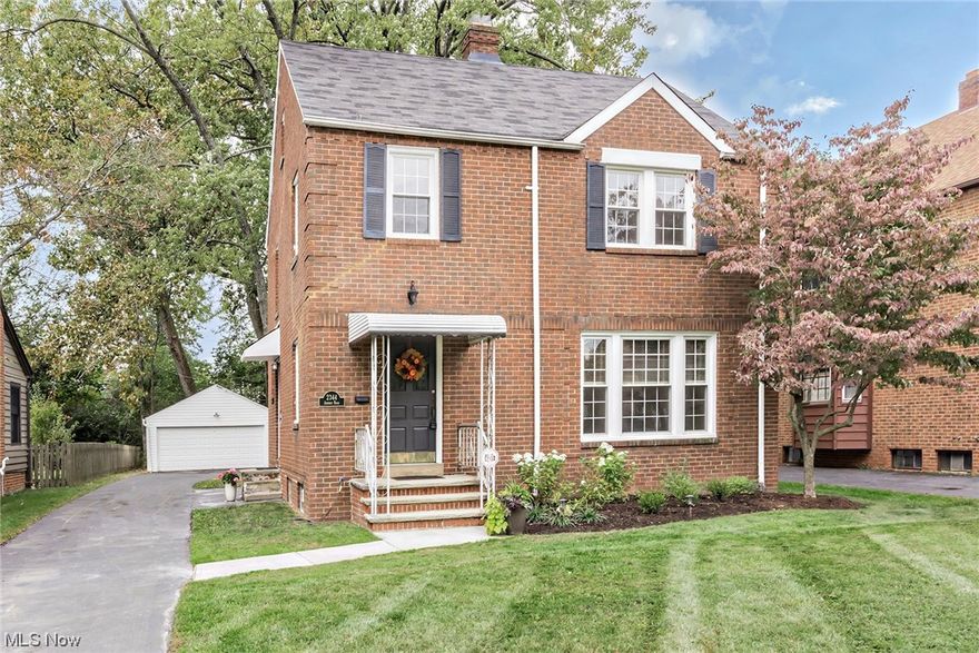 Darling all brick colonial situated on a gorgeous street in University Hts. Large living room w/ gas fireplace adjoins the formal dining room w/ gleaming hardwood floors. Spacious eat- in kitchen w/ appliances staying, including a brand-new dishwasher & great counterspace. Sun porch off back dining room w/ brand new LVT flooring. Master bedroom has double closets w/ the additional 2 bedrooms all share main hall bathroom. 3rd floor attic unfinished that can be used for storage or finish it to your liking. Finished lower-level w/ newer carpet, fireplace & wet bar perfect for hanging out. Laundry located in lower level as well. 2 car detached garage. Gorgeous yard! Newer windows '21. POS city compliant. Nothing to do but move right in!