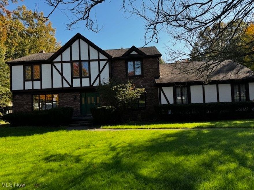 PRICE REDUCED- Make a deal!** Boardman Twp/Canfield mailing: Sitting back from the street about 200'.   This oversize 3154 sq ft large Tudor home with over 2 acres. of land and a play house/shed.  Interior consist of 4 bedrooms, 3. 1 bath, a very large family rm with fireplace and overlooking rear yard and 2 tier deck, space for your hot tub.  Formal dining room and of course a great kitchen, island in the center all new stainless steal appliances for entertaining.  1st floor utility room with a washer and gas dryer.  Full basement consist of a rec rm and wet bar with stools, a carpeted office or guest bedroom, newer furnace, A/C and h.w. tank that can be divided off. 2 sump pumps and another storage room with steps to walk out of the basement. Add finshed sq  ft makes it over 4000. All new floor coverings and much more! The 2.5 car L shape attached garage with storage also in the attic.   Again this beautiful home is looking for a new owner, it might be you! Set up your appointment with your buyer agent.