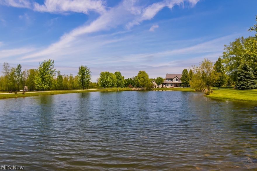 Your country dream home is on the market! Tucked back off the road along a beautiful pond, you'll adore the setting of this home on it's 4+ acre lot! Great curb appeal complete with a beautiful wrap around porch and side load 3 car garage! Beautifully appointed neutral interior! Foyer entry. Formal living room & dining rooms. You'll love the storage & counter space in the well appointed kitchen! The kitchen is equipped with a center island w/cooktop, double oven, walk in pantry,desk, spacious dining space with full bay overlooking the family room! Family room is light & airy with a stone front woodburning fireplace! First floor laundry room, spacious first floor half bath. Master suite overlooks the front pond and has an updated full bath complete with walk-in shower, heated tile flooring, double sinks! There's a large basement for storage and one finished room for crafting/hobbies! Step out back to a spacious patio, 30x50 outbuilding with three horse stalls (not used currently by owne