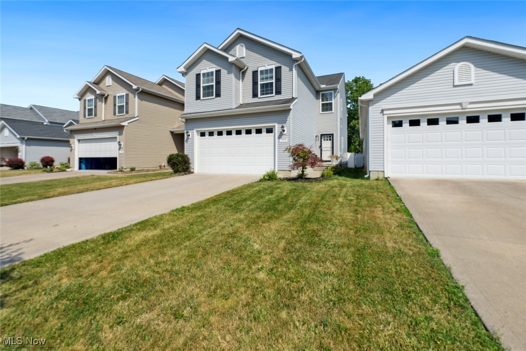 Welcome to this beautifully updated four-bedroom Colonial, offering stylish upgrades and design throughout. From the moment you enter the spacious open foyer with updated lighting, a convenient coat closet and updated half bath you'll appreciate the modern touches and move-in-ready appeal. The main level features newer luxury vinyl flooring throughout, enhancing the flow of the open-concept living spaces. The living room showcases an updated fireplace mantle and modern lighting, creating a warm and welcoming atmosphere. The kitchen has been tastefully renovated with updated appliances, new lighting, cabinets that are today's colors and seamlessly connects to the dining area, where additional cabinetry, counter space, and open shelving provide excellent storage and functionality. A redesigned pantry with a frosted glass door adds a stylish and practical touch. Between the kitchen and the two-car attached garage, the laundry room features custom cubbies perfect for keeping everyday essentials organized. Upstairs, you'll find four spacious bedrooms and a versatile loft area ideal for a home office, playroom, or lounge. The primary suite stands out with a custom accent wall and a chic barn door leading to the walk in closet. Updated en-suite bathroom, complete with a new vanity, backsplash, mirrors, lighting, and flooring, and a nice size linen closet completes the area. The partially finished basement includes a built-in bar area great for entertaining while still offering plenty of unfinished space for storage. Step outside to enjoy a fully fenced backyard featuring a vinyl fence, concrete patio with a large pergola, and a hot tub (negotiable). On top of all this home has to offer the development has a community pool for your summertime enjoyment! With a perfect mix of comfort, style, and space, this home is ready for its next chapter. Don't miss your chance to own this beautifully updated gem, schedule your showing today!