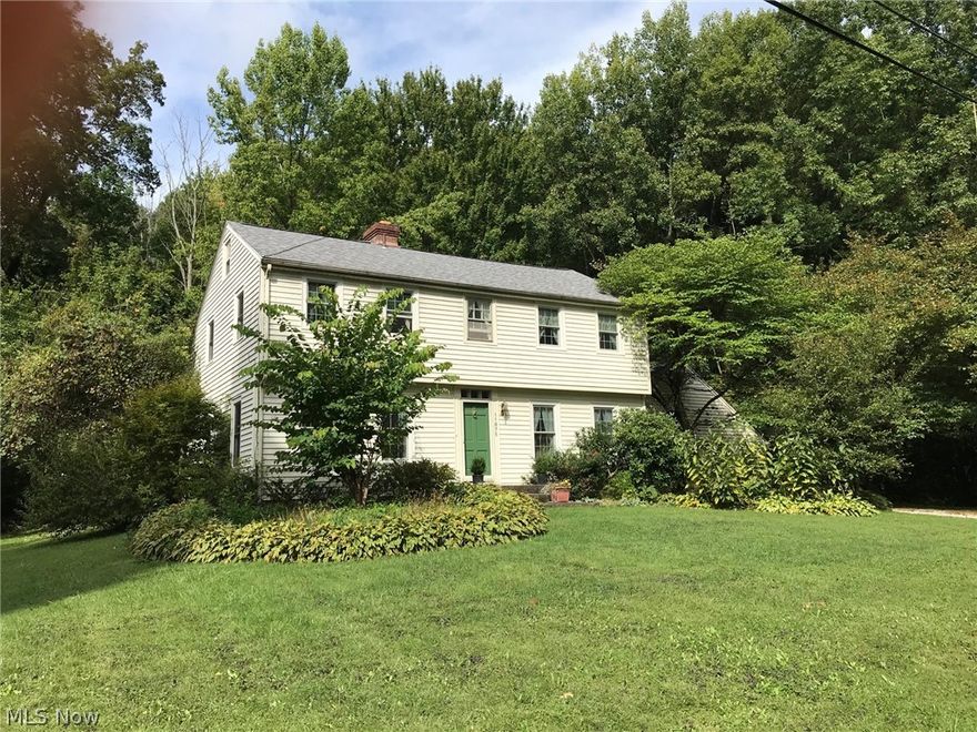 You will feel right at home in this lovely four bedroom,at the end of a cul-de-sac. This two and one half bath Colonial Saltbox is next door to Hiram College and a short drive to the Bio Med Science Academy. So much living space. Gather around the large stone fireplace in the family room with conveniently located kitchen-easy to maintain floors and the windows let in the natural light and the serenity of the outdoors. Formal dining with sliders leading out to the covered Pergola for an evening of solitude. Convenient half bath down, 2 full baths up. Four bedrooms with hardwood floors and all window treatments stay. New Anderson windows in 2011. A second w/b fireplace in the formal living room- First floor Studio for business or pleasure or 5th bedroom.  Home Warranty for peace of mind.  Very reasonable tax rate.  (Auditor may not have accurate Sq ftge.) Family room has been extended and has a view of the woods-very secluded-  and a good place for sledding for the young ones in back yar