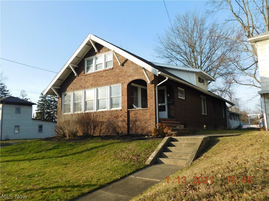 Charm and Character is offered in this Vintage Brick Bungalow.  The cozy, bright morning room is perfect to start your day or relaxing in the afternoon.  Original hardwood throughout the main level.  Beautiful glass French doors separate the rooms.  The gas fireplace is flanked by glass door bookcase and a bench.  The dining room also features a wall of built-ins and is open to the applianced kitchen.  Two bedrooms complete the main level.  One bedroom in upper level with endless possibilities of the second room.  A well-cared for home for a new owner !  Nice large lot.  New garage door.  Assessments:  $6/year Muskingum Watershed Countywide and $9.26/Year Chippewa Watershed - Indirect