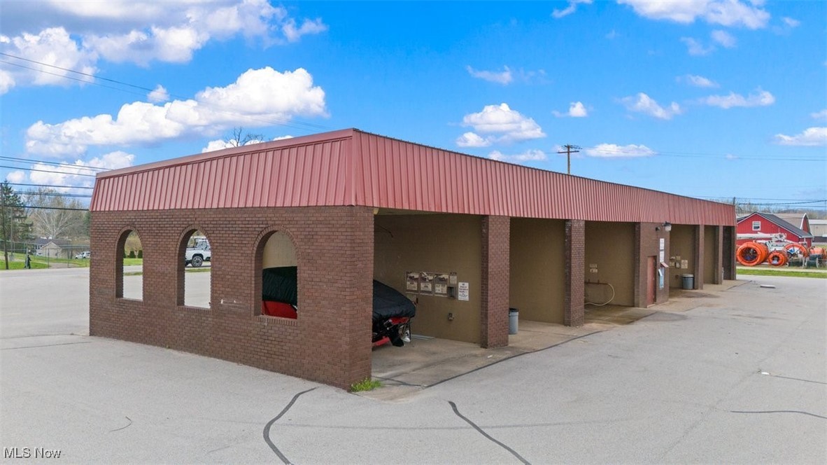If you're looking for a perfect investment opportunity located in a high traffic area, this is for you! Built in 1994, this multipurpose property includes a 6-bay car wash, 10 storage units and office space that's currently divided into 3 different rentals. The end unit has 1,559 sq ft with high ceilings, a great layout, and was home to Goldworks for over 25 years. The hair salon calls the middle unit home and is 864 sq ft. You have one more unit on the end to use for yourself, or use for additional income. Great visibility in the midst of wonderful Mineral Wells businesses. New roof and blacktop lot in the last two years. 3 phase electric. So many options, so much potential!