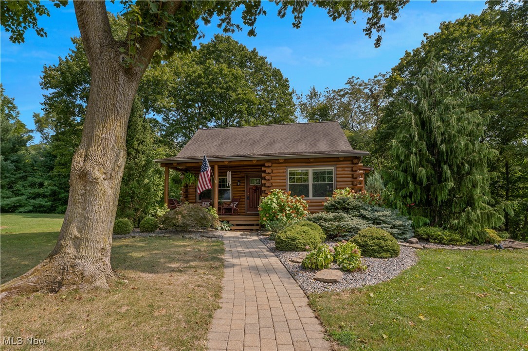 Here's your golden opportunity for that once in a lifetime home. Total log cabin!! Located on the most serene setting you can find!! Not only that, it's been completely updated! New kitchen and stove...1 yr old! Furn/AC less than 5 yrs old! Roof 12 yrs old (all wood replaced) Larger gutters added with Anderson K guards. Windows 12 yrs! HWT (2/25) Water softener and filtration system newer. Main bath remodeled 2 yrs ago along with 1/2 bath! Smoke alarms are new with 10 yr warranty. Remodeled bath in the basement also. Garage door openers 6-7 yrs old. Then there's the backyard!! Multi-level decks over looking the beautiful scenery. Waterfall in the distance. Oversized garage!!