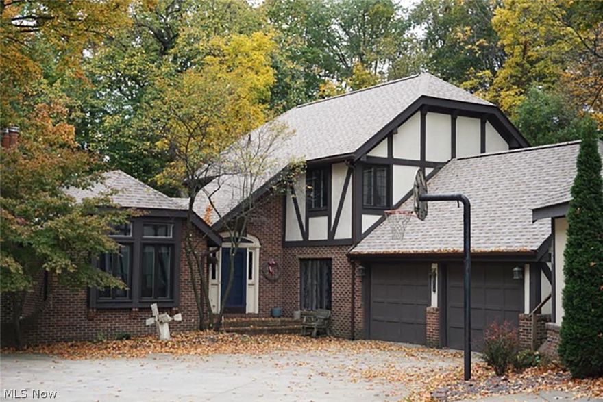 Owners downsizing, absolute auction, all sells to the highest bidder on location on Saturday – November 14, 2015 at 11:00AM - Rare Opportunity - Quality Tudor style home built in 1976.  Offers 2,087 sq. ft. w/ grand foyer entrance, French doors to formal living room with fireplace, elegant windows, trayed ceiling (possible first floor master bedroom).  Kitchen w/ whitewashed cabinetry, fully applianced.  Half bath & laundry off kitchen.  Dining room with hardwood flooring. Family room w/fireplace. Enclosed rear porch, w/cedar vaulted ceiling w/skylights. Second level features master bedroom suite with private bath, plus two additional bedrooms with full bath. Lower walk out level w/wood burner. Radiant heat, A/C. Well & septic, home and shop shingles replaced 9/15. Rear deck w/ hot tub. Charming cottage features oak kitchenette, living room, bedroom & full bath. Could be small business or in-law suite. View of koi pond. Large open span 30’ x 100’ hobby shop/garage, radiant floor heat.