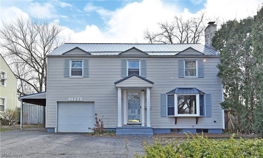 Don’t hesitate, this spacious, four-bedroom Warren home won’t be around for long! Offering a unique two-story layout with a huge fenced-in yard, it’s going to rank highly on more lists than one. A beautiful exterior quickly showcases the elegant, covered entryway and picturesque bay window that illuminates the spacious living room as you step inside. Here, rich hardwood flooring showcases the central fireplace as it continues into the nearby formal dining room. The galley kitchen is trimmed in a mix of stylish brick, custom woodwork, and stainless appliances that follow into the huge great room. Relax in the natural light from the massive picture window while the second brick fireplace is the centerpiece of the room. A fantastic bar area is located right around the corner, pairing with a half bath to complete the floor. Upstairs, the impressive master suite offers a walk-in closet and full bathroom. Three additional nicely sized bedrooms line the winding hall; each to feature hardwood