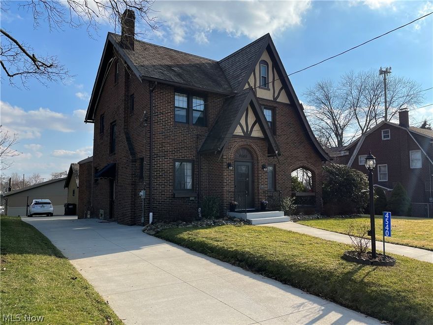 This impressive Tudor-style revival home was built in 1927 and is located in Perry School District. The home has been fully modernized and still
holds all o the fantasy-like features that you'd have noticed before being updated. The main entry leads you into the great room where the gas
fireplace is located as well as the private outdoor porch area The dining area offers built-ins. The dining room also has a chandelier and light
fixtures that are complementary to the style and era of the home. You are then led to the kitchen, which is a statement piece and truly the heart
of this home. Great cabinet space, new appliances, tall ceilings, and granite countertops. Mail-level laundry is also off of the kitchen. The
upstairs has four total bedrooms. The master bedroom has a step-in closet that is large. One bedroom is currently being used for an office, and
another for storage. The third-level bedroom has very tall ceilings, a walk-in closet, and a built-in desk. The bedroom also has