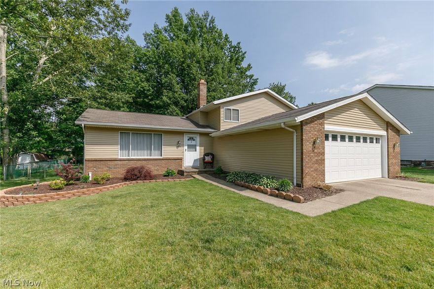 What a wonderful place to call home! This lovely 4-level split boasts over 2,000 sq. ft. of living space, 3 bedrooms & 2.5 bathrooms; plus a basement for all of your storage needs! Attractive curb appeal from the moment you pull up, w/ updated landscaping & fresh exterior paint. Enter the home through the inviting foyer w/ new front door(2013), opening to the vaulted living & dining rooms featuring updated laminate flooring that flows into the eat-in kitchen w/ crisp white cabinetry, included appliances & a large sliding door leading to the rear deck. Step down into the huge family room w/ recessed lighting & brick wood burning fireplace; this room is perfect for entertaining & relaxing w/ your loved ones. The remodeled laundry room supplies built in cabinets & utility tub. The waterproofed basement is found off the family room. All 3 bedrooms are located on the upper level w/ generous closet space. The master features 2 closets & a full en suite bath. You will enjoy the fenced in yard