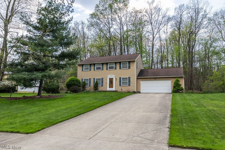 Welcome to a spacious Colonial in beautiful Macedonia! This four bedroom, two and half bathroom offers spacious rooms, natural light and room to grow! As you walk in, the floor plan offers a large dining room just adjacent from a large living room and a half bathroom for your convenience.  A two-car attached garage enters into an eat in kitchen opens up to a family room with a cozy fire place and access to a nice size deck overlooking natures beauty with a private back yard. Upstairs offers four bedrooms with great storage including main bedroom with a nice size walk in closet and private piece bathroom. Another full bathroom finished up the second floor. A full size waterproofed basement with high ceilings and washer/dryer hook up offers so much potential. Located close to so many amenities including shopping, restaurants and easy access to multiple highways. With your own touch, this spacious house can be your home! Interior photos to come...