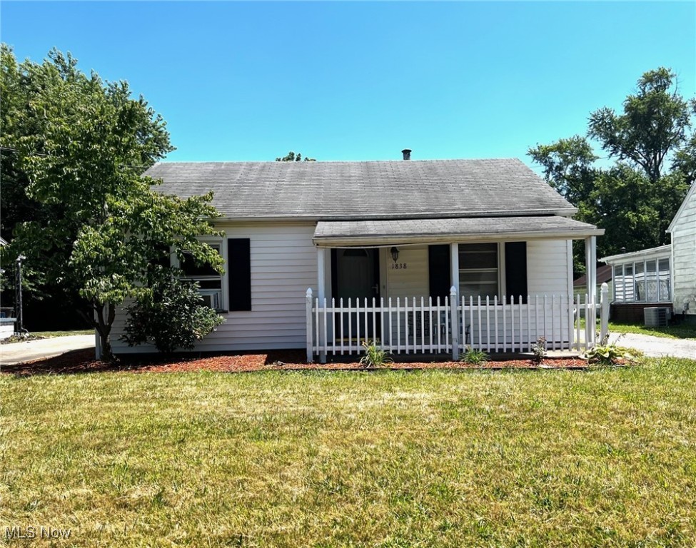 This cozy 2-bedroom, 1-bath ranch home offers a perfect blend of comfort and convenience. Nestled in a quiet NW neighborhood, this residence is ideal for flippers, first-time homebuyers, small families, or anyone looking to downsize. As you enter from the covered front porch, you're greeted by the spacious living room. The bathroom is conveniently located near the two good-sized bedrooms with great natural light, each offering ample closet space. The bonus room at the back of the house offers additional living space for relaxation or additional storage The yard is spacious and ideal for small gardening, play, or hosting BBQs. Appliances are needed for the eat-in kitchen, as well as, a new furnace and AC, if desired. The current owner is leaving a window AC unit, 2 space heaters, and a small portable washing machine. There is a 2 car detached garage and new electric service. Call today for a private showing.