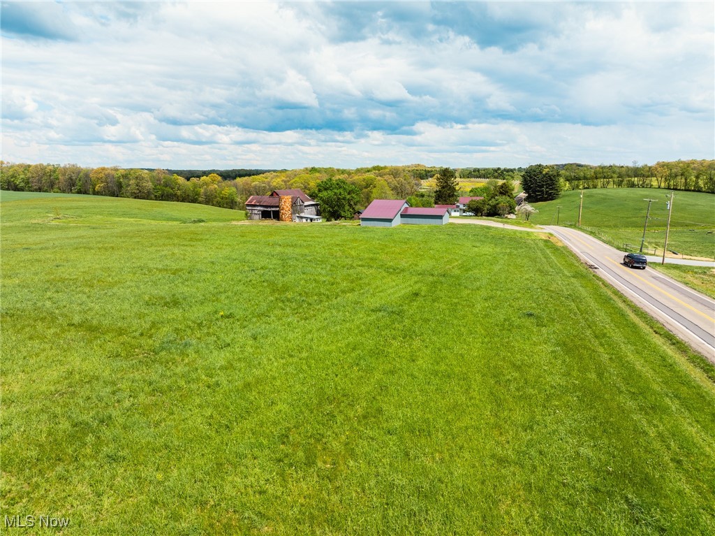 ONLINE ONLY AUCTION WEDNESDAY JULY 30TH 6:00 PM!! Parcel 3 of 5. Build, farm, or simply enjoy the beauty — the choice is yours! This scenic 25-acre farm is nestled in the rolling hills of Carroll County and is ideally located just minutes from Atwood Lake and Carrollton. Parcel 4 features a charming 2,204 sq ft two-story home with 3 bedrooms, 2 baths, a covered front porch, back deck, and a full basement —and is ready for your finishing touches. Also included is an older bank barn and an approx. 24' x 86' shop building with electric and concrete floor, all situated on 5 acres. The remaining 4 spacious parcels each offer unique, scenic country building sites with gently rolling, open tillable ground. Whether you're looking for a peaceful country hobby farm, a beautiful building site, or an investment in quality land, this property has something for everyone. Bid on a single parcel, combine several, or purchase the entire farm—you decide how to buy. Utilities to the home include electric, propane furnace heat, private well, and septic system. Don’t miss this incredible opportunity—contact us today or join us for the open house!
Parcel 1: 316 ft frontage, Building Site, 4.4 Acres
Parcel 2: 60 ft frontage, Building Site, 5.8 Acres
Parcel 3: 910 ft frontage, Building Site, 4.8 Acres
Parcel 4: 419 ft frontage, Home & Outbuildings, 5 Acres
Parcel 5: 403 ft frontage, Building Site, 5.5 Acres