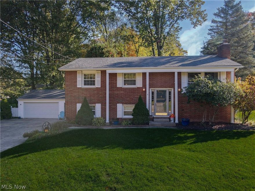 Call today to see this beautifully renovated home in the Stow school district! The spacious Living Room has a gas fireplace, large windows and lots of natural light. The main level includes rich hardwood floors throughout. Enjoy every season from the cathedral Sun Room surrounded by windows and overlooking the gorgeous lot. The renovated kitchen includes custom birch cabinets, quartz counter tops and stainless steel appliances. The lower level includes a family room with a second fireplace and an additional full bath. Some of the major updates include a high efficiency furnace and central air, updated windows, dimensional shingle roof, new electric panel and updated baths. The original attached garage has been converted to a workshop plus a 2 1/2 car detached garage and storage shed. Outdoors, enjoy the maintenance free composite deck, lower patio and park-like lot. Must see!!
