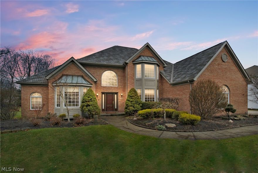 Spacious Stunning Home. 2 Story Foyer with Marble Tile Floor, newer custom door and round window. 1st Floor Office/Den with wood floors. Large formal dining room with bayed window. Luxury spectacular gourmet Kitchen with refinished hardwood floors, Custom Cabinets, newer Granite counters, backsplash and all appliances stay!! Spacious open concept Family Room with Fireplace and Door to Covered Patio. The 1st Floor Owners Suite features a Walk-in Closet and Glamour Bath. 3 Additional Bedrooms on the Second. Large Unfinished Area that could be Finished as another bedroom or Bonus Room. First floor full bath, and laundry room w/built-in cabinets. Newer carpeting and newly painted. Finished Lower Level has a Large Rec. Room with Fireplace, Bar Area, 2nd Kitchen, Half Bathroom, and loads of Storage. 3 Car Side Load Garage, Large Covered Patio. Professionally landscaped private lot. Newer Roof, Furnace and A/C. Prime Location. Pride of ownership. Great Value! A True Must See!!! Award winning