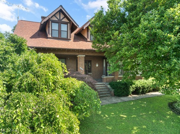 Discover the perfect blend of historic charm and modern comfort in this stunning 4-bedroom, 3 bath colonial home built in 1920 and thoughtfully updated throughout. From the moment you enter, you're greeted with beautifully refinished natural hardwood floors (2017), rich woodwork, and elegant coffered or beamed ceilings that showcase the home's timeless craftsmanship. Classic pocket doors in the formal living room and dining rooms, original trim, built ins and 4 gas fireplaces have been lovingly preserved, while key updates ensure comfort and peace of mind. The kitchen has been tastefully redone with custom Schrock cabinets and the bathrooms have been modernized to suit today's lifestyle without compromising the home's character. You'll love the additional living space in the basement, where the updates include family/media room, kitchenette, art studio and new bathroom. Outside, a detached carriage-style garage adds to the home's historic charm and the .61-acre lot offers room to relax and entertain. The valet-style parking adds charm and functionality. This home is a blend of historic elegance and thoughtful updates. Schedule your showing today to see this special property.