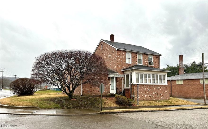 Discover classic charm and modern comfort in this well-kept 3 bedroom, 2 bathroom brick home - perfectly located in downtown Wellsburg. With spacious living areas and thoughtful updates, this property offers both convenience and character. Step inside to a warm and inviting family room addition featuring a cozy fireplace, perfect for relaxing evenings or bringing in the New Year with family and friends! The main level also includes a formal dining room, a comfortable living room, and a functional kitchen ready for your personal touch. Upstairs, you’ll find three generously sized bedrooms and a full bath, providing plenty of room for family or guests. Additional perks include a rear sunroom off of the dining room for enjoying your morning coffee and an enclosed side porch for further relaxing - plus a 1-car garage located in the basement, offering storage and convenience. Whether you're looking for a forever home or a smart investment, start off your New Year right with this downtown gem that is full of potential and charm. Don’t miss your chance to own a beautiful piece of Wellsburg!