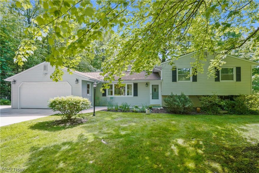 This well-maintained 4-bedroom, 2 bathroom home is bursting with character & updates, making it the perfect blend of charm & convenience. The living room's woodburning stove creates a cozy atmosphere, while the sunroom allows you to enjoy the outdoors without worrying about bugs. Step outside to the patio & fenced yard, where mature trees provide shade and a park-like setting. The lower level boasts a second living room w/ a built-in bookshelf and desk, along with a hidden record player! Key updates throughout the home include a brand-new boiler (2/24), a pristine concrete driveway w/ a convenient turnaround pad, & a 4' wide front walk (7/23), carpet on both staircases & the upstairs landing (11/23), upstairs bathroom has been beautifully updated w/ a large vanity, granite countertop, tile floor, tub/shower. New (11/23), beautiful vinyl plank flooring throughout the lower level bathroom & laundry room. Lower level walkout to the backyard through a newer door & screen door. The garage floor is finished with new (6/23) Everstone Floors, a slip-resistant surface, & the garage itself is equipped w/ a workbench & a window w/ a view. The lower level bathroom is ADA compliant w/ wide door for wheelchair access, walk-in shower featuring hand bars, a fold-down seat, & a shower head that can be handheld . This bathroom also includes a heat lamp for added comfort. The versatile 4th bedroom on the main floor can serve as a private space for an in-law or teen, or be used as an office, playroom, or extra dining area to accommodate gatherings. Separate heat & AC wall unit can be found in this room. Enjoy a wooded view out the front of the home, rather than looking at another house. Storage is plentiful throughout the home, ensuring you have ample space for all your needs. Located in close proximity to shopping, restaurants, banking, parks, & more, this home offers the ultimate in convenience. Plus, it's situated within the 5-star, award-winning West Geauga School District!