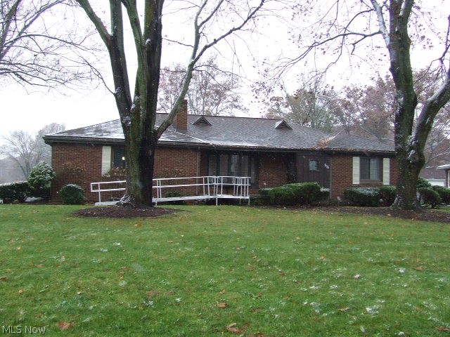 A beautiful setting for this all brick ranch in the West Akron area near Fairlawn Country Club. The foyer opens to a large open living and dining area highlighted with a lovely wood burning fireplace and huge bay window to show it off. The formal yet open dining room has a built-in corner hutch, and its own large bay window overlooking the backyard. The large eat-in kitchen has its own backyard access, breakfast bar and loads of cabinet and counter space and a pantry! All appliances stay, including the washer dryer. Master bedroom with bath and walk-in closet, another bedroom, main bath and a third bedroom that's being used as a den, but could be used as a third bedroom, complete the first floor. The basement has a finished rec room, with fireplace, and loads of storage. A separate workshop area and laundry area also. A two car attached garage, nicely landscaped frontage, and large, flat back yard adds to the appeal of this home. Just a little TLC would turn this into your perfec