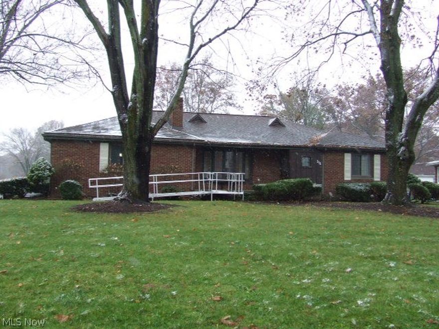 A beautiful setting for this all brick ranch in the West Akron area near Fairlawn Country Club. The foyer opens to a large open living and dining area highlighted with a lovely wood burning fireplace and huge bay window to show it off. The formal yet open dining room has a built-in corner hutch, and its own large bay window overlooking the backyard.  The large eat-in kitchen has its own backyard access, breakfast bar and loads of cabinet and counter space and a pantry!  All appliances stay, including the washer dryer. Master bedroom with bath and walk-in closet, another bedroom, main bath and a third bedroom that's being used as a den, but could be used as a third bedroom, complete the first floor.  The basement has a finished rec room, with fireplace, and loads of storage.  A separate workshop area and laundry area also.  A two car attached garage, nicely landscaped frontage, and large, flat back yard adds to the appeal of this home.  Just a little TLC would turn this into your perfec