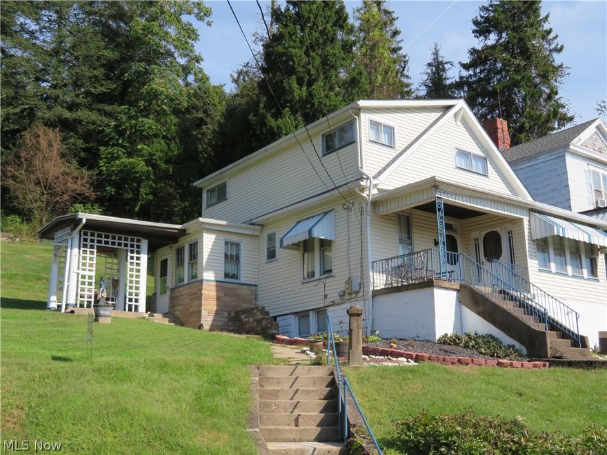 Country feel with this home overlooking the valley.  Main floor bedroom and bath with main floor laundry makes for easy one floor living.  Large eat in kitchen and living room has a nice decorative fireplace.  Siding and roof 2010, furnace and central air 2000.  220 amp electric service and updated wiring.  There is parking across the street and a pull off into the yard that use to be used to access property.  The single garage is used for storage but could be torn down to make additional parking.  Seller will retain mineral rights.