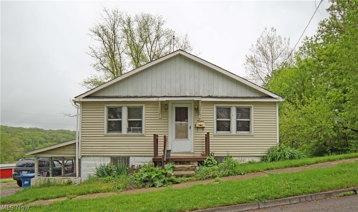 This single story home sits on a corner lot and comes with a second parcel making it a quarter of an acre. You’ll love the large size rooms and kitchen. 2 bedrooms, 1 bath. Full basement with half bath is a walk-out and next to the 1 car garage. There is an enclosed porch off the kitchen and a covered patio at Basement level. Owner has installed a new water heater 2018, updated electric to 200 amp, replaced patio roof 2016, did back roof 2015, installed french drain in back of the garage 2017. Selling As-Is.