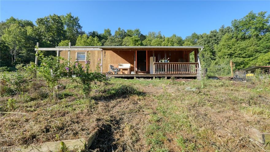 Discover your ideal off-grid retreat! This one-bedroom home sits on approximately 10 acres, featuring a balance of open space and wooded acreage. While the home does not currently have water or electric service, it is set up to run electric from a generator, and gas is already in place. Whether you’re looking for a hunting cabin, an off-grid lifestyle, or a temporary residence while you build your dream home, this property offers endless potential.