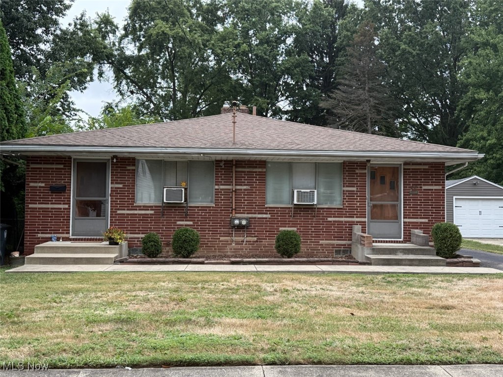 Solid brick twin-plex with 2 bedrooms, 1 bath on each side and separate basements. One side has a walk-out basement and both have attached single car garages.