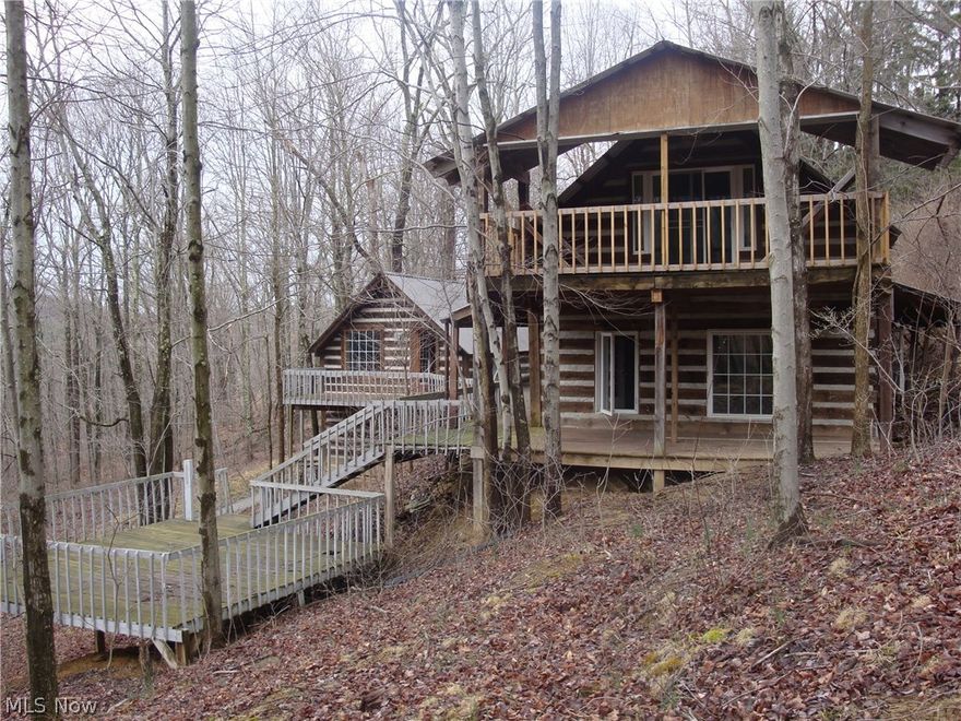 Must see to believe! This newly built log home is move in ready! It includes a large porch which goes half way around the home, and a porch off the upstairs bedroom. There is also a large kitchen with new wood floors and plenty of dining area! There is one bedroom downstairs and two large bedrooms upstairs with an extra built in bed for your extra guests! The outside has an outbuilding that is ready for your projects or can be converted into a cottage for extra guest space. The home is located within walking distance from piedmont lake, with docks available for boats and kayaks. The house has plenty of woods all around it, which provides plenty of privacy and shade. There is a driveway on either side of the property, on side is a shared driveway. The owner is transferring the mineral rights to the seller, which will be conveyed as soon as the lease expires.