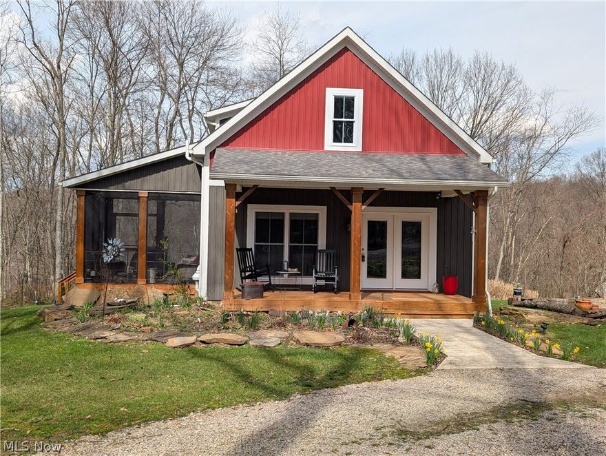 Welcome to 10073 Dunlap Rd, Cambridge, OH.  This home was built in 2020 and sits on a 5-acre wooded lot.  This property is full of wildlife, trees and lots of flowers that will brighten up anybody’s day.  The house offers an open-floor plan with a vaulted ceiling in the main living area.  The first floor is very inviting as it has a large living room and dining space that opens into kitchen.  The kitchen comes with plenty of cabinets, granite counters, large island and SS appliances. Also, on the main level is the Master bedroom with his and her closets, full bathroom and walks out to its private deck.  The laundry room is on the main floor.  Upstairs there is a loft area, 2 bedrooms and full bathroom.  Next, we will head to the basement that has a large living room, and a big bathroom with soaker tub.  The basement also has 2 utility/storage rooms and an area for an office.  For added convenience the basement has French doors that walk out to the back yard. This property is perfect for entertaining or just relaxing as you have a covered front porch and a covered and screened side porch that is accessible from the kitchen.  If you are an outdoorsman, then you will enjoy the park like setting on this property.  The 5-acre lot is mostly wooded and has a large fire pit area and garden area.  To complete this property, you have a circular driveway, a one car garage and an added container for storage.  Mineral, Oil & Gas Rights are excluded. This property is conveniently located just minutes to Cambridge. Schedule your showing today to see this wonderful home.