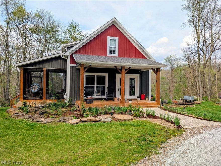 Welcome to 10073 Dunlap Rd, Cambridge, OH.  This home was built in 2020 and sits on a 5-acre wooded lot.  This property is full of wildlife, trees and lots of flowers that will brighten up anybody’s day.  The house offers an open-floor plan with a vaulted ceiling in the main living area.  The first floor is very inviting as it has a large living room and dining space that opens into kitchen.  The kitchen comes with plenty of cabinets, granite counters, large island and SS appliances. Also, on the main level is the Master bedroom with his and her closets, full bathroom and walks out to its private deck.  The laundry room is on the main floor.  Upstairs there is a loft area, 2 bedrooms and full bathroom.  Next, we will head to the basement that has a large living room, and a big bathroom with soaker tub.  The basement also has 2 utility/storage rooms and an area for an office.  For added convenience the basement has French doors that walk out to the back yard. This property is perfect for entertaining or just relaxing as you have a covered front porch and a covered and screened side porch that is accessible from the kitchen.  If you are an outdoorsman, then you will enjoy the park like setting on this property.  The 5-acre lot is mostly wooded and has a large fire pit area and garden area.  To complete this property, you have a circular driveway, a one car garage and an added container for storage.  Mineral, Oil & Gas Rights are excluded. This property is conveniently located just minutes to Cambridge and only 7 miles to Salt Fork Lake. Schedule your showing today to see this wonderful home.