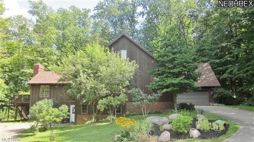 Do you need an additional living suite for a family member or friend right in your own home, but completely seperate?  Well here is your home! Built on almost 5 wooded & private acres, this home boasts a finished walk out LL , w/ separate entrance & 1 car garage, ideal for an additional living suite, with a 2nd Kitchen, 2 bedrooms, full bath, Laundry & Living Room w/ fireplace. The main living area has a beautiful Kitchen w/ Center Island, Desk, & stunning Octagonal Breakfast Room.  Formal Dining Rm if you desire with trayed ceiling, crown molding & chair railing. Or entertain in the spacious Great Rm w/ stone WBF & hearth, vaulted beamed wood ceiling & wet bar. The 2nd floor has a Loft area & 2 additional unfinished rooms.  A huge Garage(43x40) is included as a workshop or store those cars or tractors, landscape business or contractor. And a Sugar Shack ready to be fired up. Roofs replaced 2013! Easy access to freeways and shopping!