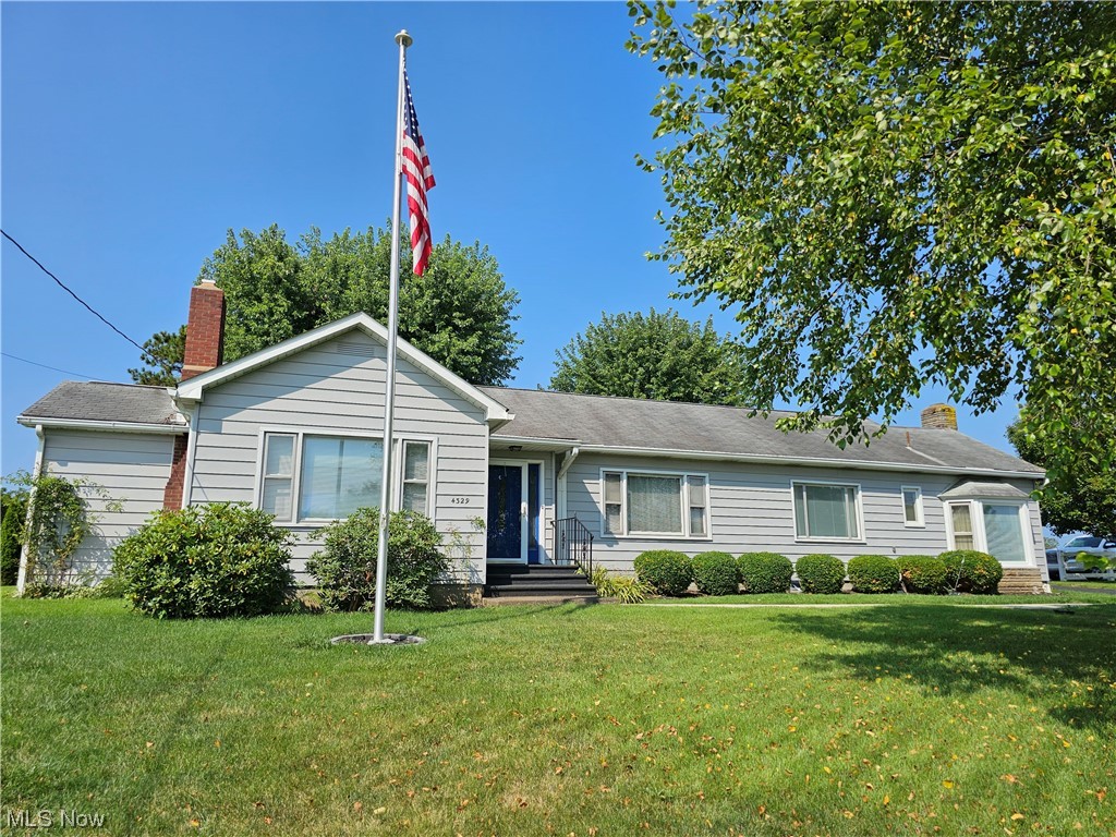 Who is looking for a charming home just outside of town yet within easy drive of small town amenities of stores, elementary school, and a doctor's office? The home features over 2500 sq ft of living area (total of 3959) and gives the owners plenty of room to enjoy together while also having separate areas for alone time. Kitchen has Schaad cabinets, stainless steel appliances, and a butler's pantry with sink. Hardwood floors are under most of the carpet! Bedrooms are good size and wait until you see the size of the main bathroom! The heated sunroom is used as a third sitting room with lots of windows to watch the sunsets. First floor ldry room has a 3-compartment sink, a second refrigerator, and one of two furnaces for the home plus additional shelving. Plenty of storage areas! Home sits on a corner lot and has two entries to the paved curved driveway. A generator is hardwired in to run the majority of the home during a power outage. AND THEN there's the 3-car garage with over 11